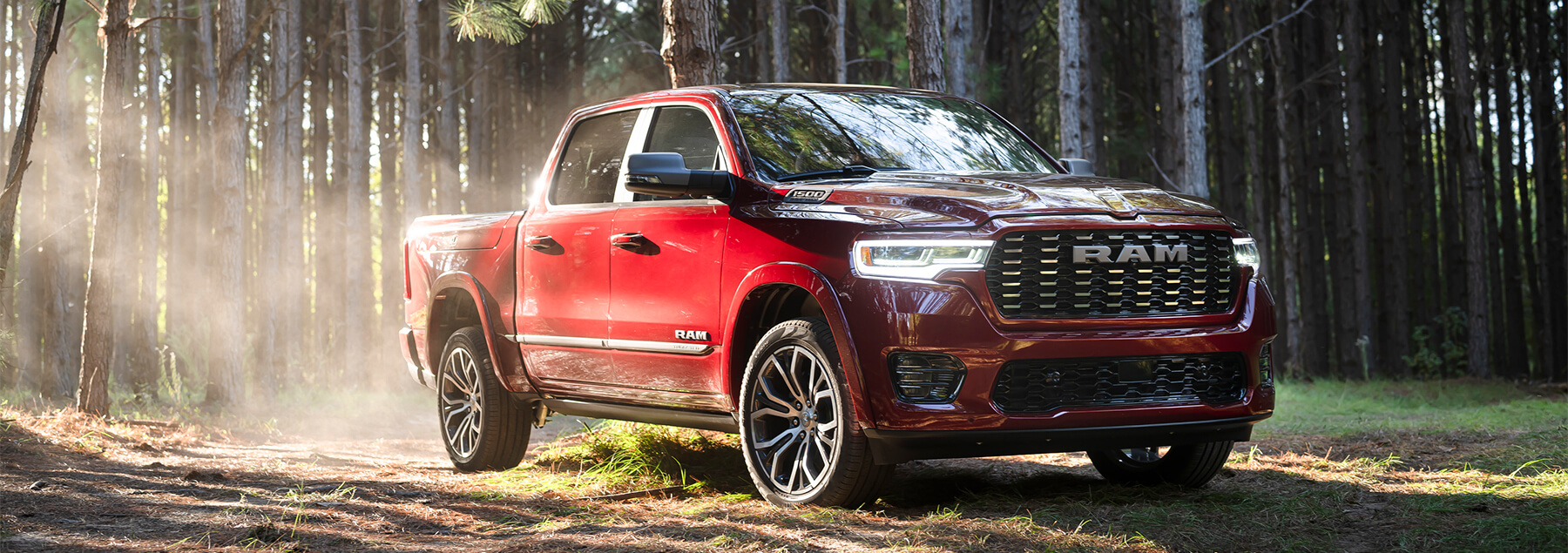 A 2025 RAM 1500 being driven in a forest. 